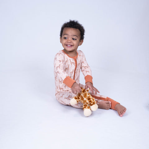 Child wearing a printed LollyBanks zip pajama