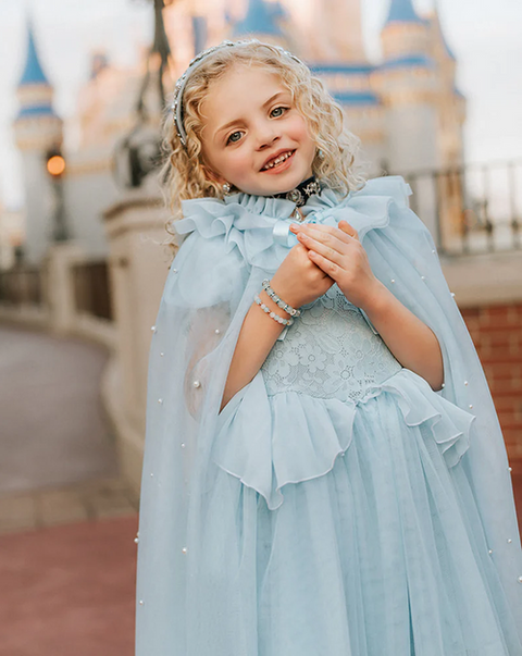 Child wearing a blue Only Little Once princess dress