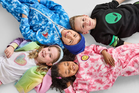 Children wearing colorful Rebloomed Kids clothing