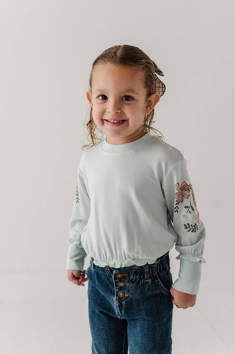 Girls Ruffle Hem Sweatshirt in Floral Sleeves Misty Blue