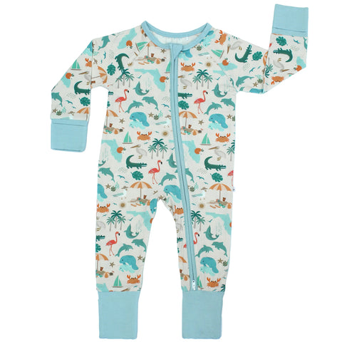 Baby bamboo pajama with long sleeves, footless design, and a pattern featuring various animals and flora related to Florida.