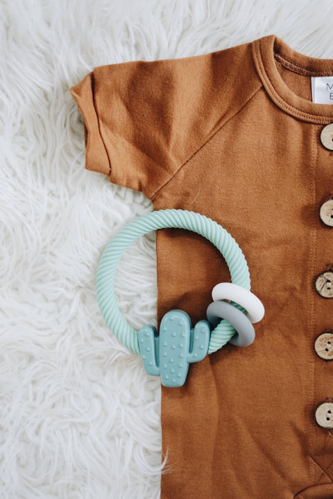 Ritzy Rattle™ Silicone Teething Rattle - Highland Cow